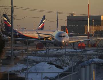Aeroflot's passenger planes are parked at Sheremetyevo airport, outside Moscow, Russia, on Tuesday. Aeroflot said Monday that it suspended flights to New York, Washington, Miami and Los Angeles through Wednesday because Canada has closed its airspace to Russian planes. (Pavel Golovkin/AP)