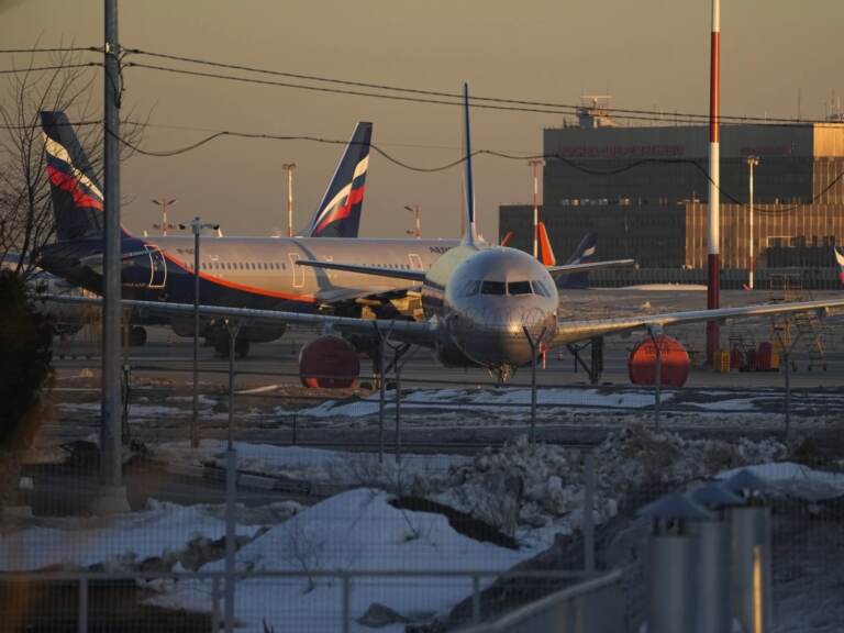 Aeroflot's passenger planes are parked at Sheremetyevo airport, outside Moscow, Russia, on Tuesday. Aeroflot said Monday that it suspended flights to New York, Washington, Miami and Los Angeles through Wednesday because Canada has closed its airspace to Russian planes. (Pavel Golovkin/AP)