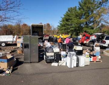 A group of employees collect e-waste at PAR-Recycle in North Philadelphia.