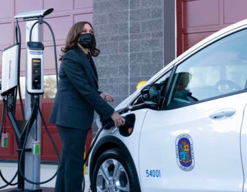 Vice President Kamala Harris charges an electric vehicle in one of the charging stations during her tour of the Brandywine Maintenance Facility in Prince George's County, Md., highlighting the electric vehicle investments in the bipartisan infrastructure law and the 