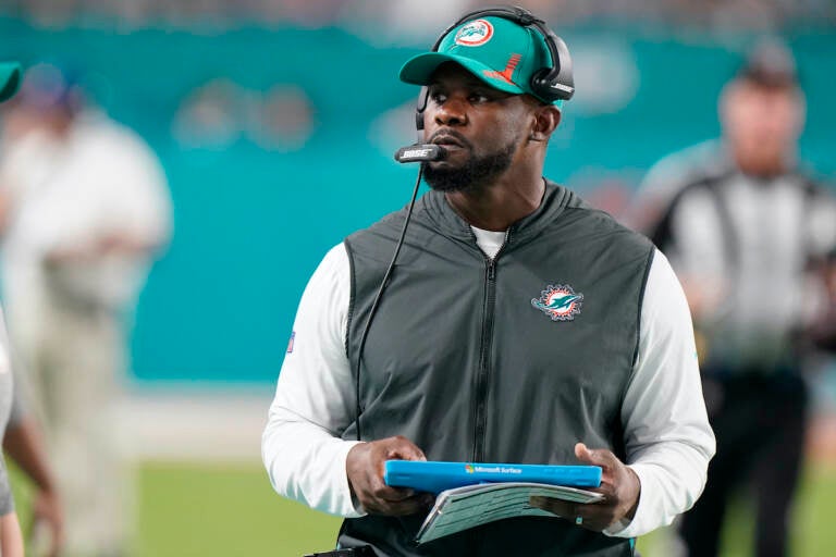 File photo: Miami Dolphins head coach Brian Flores stands on the sideline during the second half of an NFL football game against the New England Patriots, Sunday, Jan. 9, 2022, in Miami Gardens, Fla. (AP Photo/Wilfredo Lee)