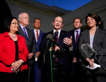 Sen. Chris Coons, D-Del., center, speaks with reporters after he and Democratic members of the Senate Judiciary Committee met with President Joe Biden to discuss the upcoming Supreme Court vacancy, Thursday, Feb. 10, 2022, at the White House in Washington. (AP Photo/Patrick Semansky)