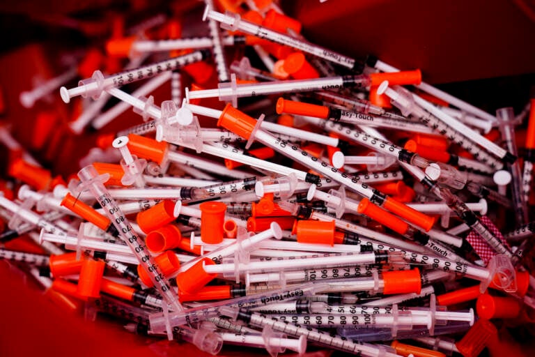 Shown are used syringes collected at a needle exchange run by Camden Area Health Education Center in Camden, N.J., Thursday, Feb. 24, 2022. (AP Photo/Matt Rourke)
