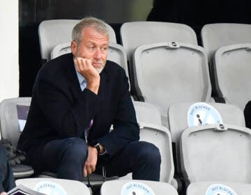 Chelsea soccer club owner Roman Abramovich, right, attends the UEFA Women's Champions League final soccer match between Chelsea FC and FC Barcelona in Gothenburg, Sweden, Sunday, May 16, 2021