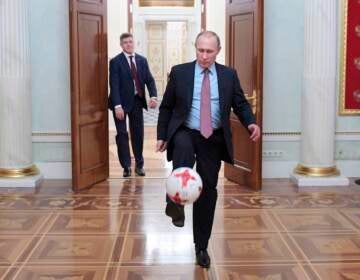 File photo: Russian President Vladimir Putin, foreground, plays with an official match ball for the 2017 FIFA Confederations Cup received from FIFA President Gianni Infantino, after their meeting in the Kremlin in Moscow, Russia, Friday, Nov. 25, 2016. (Alexei Druzhinin, Sputnik, Kremlin Pool Photo via AP, File)