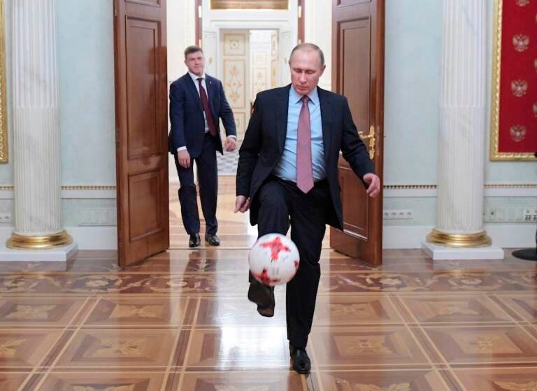 File photo: Russian President Vladimir Putin, foreground, plays with an official match ball for the 2017 FIFA Confederations Cup received from FIFA President Gianni Infantino, after their meeting in the Kremlin in Moscow, Russia, Friday, Nov. 25, 2016. (Alexei Druzhinin, Sputnik, Kremlin Pool Photo via AP, File)