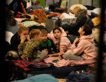 Children, fleeing from Ukraine,play in a shelter designed for women and children at the train station in Przemysl, Poland, Thursday, March 3, 2022. (AP Photo/Markus Schreiber)