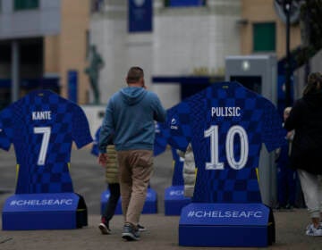 Tourists visit Stamford Bridge stadium home of Chelsea football club in London,  Thursday, March 3, 2022. (AP Photo/Alastair Grant)