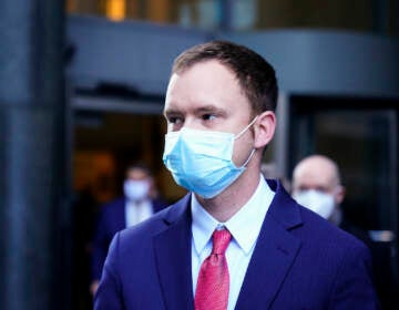 Brandon Bostian, the Amtrak engineer involved in a 2015 derailment in Philadelphia that killed eight people and injured more than 200, walks from the criminal justice center in Philadelphia, Thursday, March 3, 2022. (AP Photo/Matt Rourke)