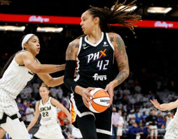 File photo: Phoenix Mercury center Brittney Griner (42) looks to pass as Chicago Sky center Candace Parker defends during the first half of game 1 of the WNBA basketball Finals , Sunday, Oct. 10, 2021, in Phoenix.(AP Photo/Ralph Freso)
