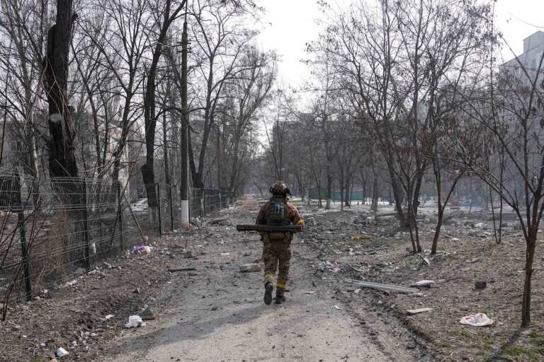 A Ukrainian serviceman walks near the position he was guarding in Mariupol, Ukraine, Saturday, March 12, 2022. Ukraine’s military says Russian forces have captured the eastern outskirts of the besieged city of Mariupol. In a Facebook update Saturday, the military said the capture of Mariupol and Severodonetsk in the east were a priority for Russian forces. Mariupol has been under siege for over a week, with no electricity, gas or water