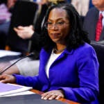 Supreme Court nominee Judge Ketanji Brown Jackson takes her seat before the start of her confirmation hearing before the Senate Judiciary Committee Monday, March 21, 2022, on Capitol Hill in Washington.