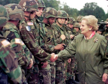U.S. Secretary of State Madeleine Albright shakes hands with U.S. soldiers during her visit to Air Base Eagle near Tuzla, Aug, 30, 1998. Albright has died of cancer, her family said Wednesday, March 23, 2022.(AP Photo/Amel Emric, File)