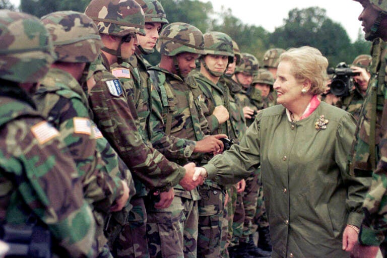 U.S. Secretary of State Madeleine Albright shakes hands with U.S. soldiers during her visit to Air Base Eagle near Tuzla, Aug, 30, 1998. Albright has died of cancer, her family said Wednesday, March 23, 2022.(AP Photo/Amel Emric, File)