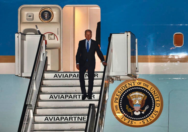 U.S. President Joe Biden steps off Air Force One as he arrives at Melsbroek military airport in Brussels, Wednesday, March 23, 2022. Western leaders are arriving in Brussels for Thursday's summits taking place at NATO and EU headquarters where they will seek to highlight their sense of unity in the face of the Russian invasion in Ukraine