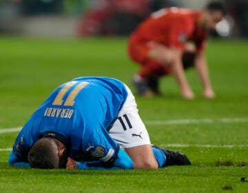 Italy's Domenico Berardi drops to his knees after missing a scoring chance during the World Cup qualifying play-off soccer match between Italy and North Macedonia, at Renzo Barbera stadium, in Palermo, Italy, Thursday, March 24, 2022. (AP Photo/Antonio Calanni)