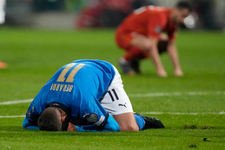 Italy's Domenico Berardi drops to his knees after missing a scoring chance during the World Cup qualifying play-off soccer match between Italy and North Macedonia, at Renzo Barbera stadium, in Palermo, Italy, Thursday, March 24, 2022. (AP Photo/Antonio Calanni)