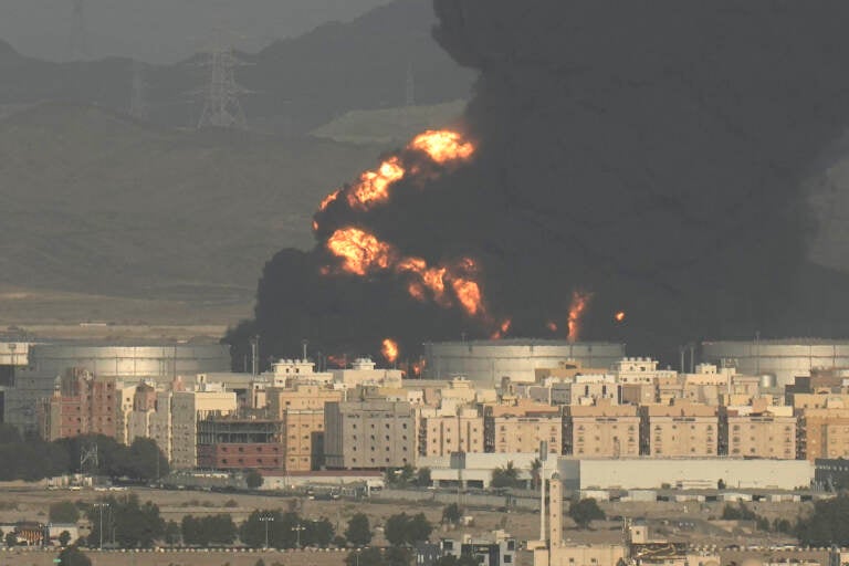 A cloud of smoke rises from a burning oil depot in Jiddah, Saudi Arabia, Friday, March 25, 2022