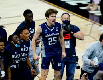 Saint Peter's Doug Edert celebrates after Saint Peter's won a college basketball game against Purdue in the Sweet 16 round of the NCAA tournament, Friday, March 25, 2022, in Philadelphia. (AP Photo/Matt Slocum)