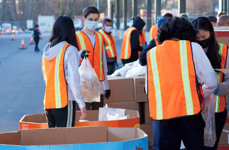 Workers at the Food Bank of South Jersey load food for distribution