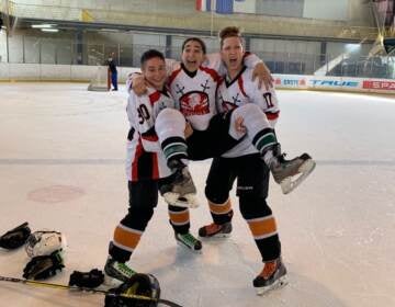 Anna Gardner (middle) held up by Alika (left) and Vika Gadliya (right) following a tournament in Zagreb