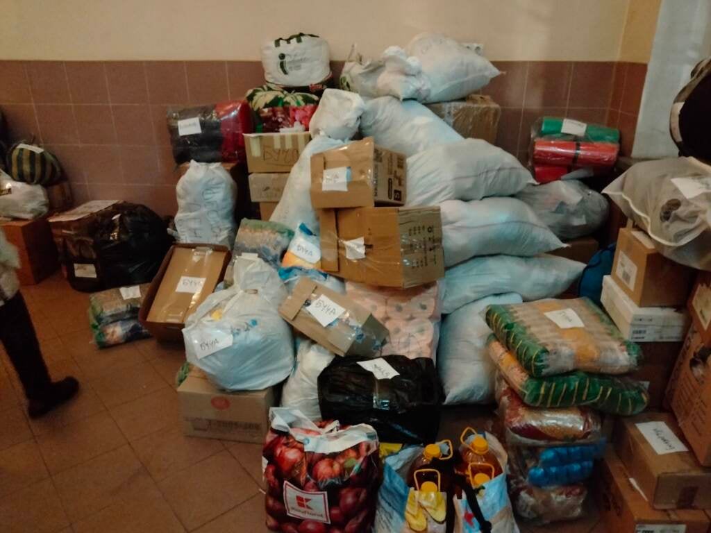 A pile of boxes and trashbags full of supplies for Ukrainian refugees are shown on the ground at Bethany Slavic Church in Central Pa.