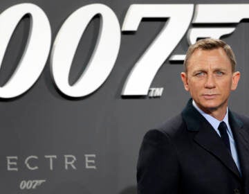 FILE - In this Oct. 28, 2015, file photo, actor Daniel Craig poses for the media as he arrives for the German premiere of the James Bond movie 'Spectre' in Berlin, Germany. Amazon, on Wednesday, May 26, 2021, is buying MGM, the movie and TV studio behind James Bond, “Legally Blonde” and “Shark Tank,” with the hopes of filling its video streaming service with more stuff to watch