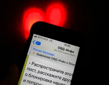 An iPhone screen shows a Telegram account of OVD-Info, prominent legal aid group in Russia that tracks political arrests in Moscow. (Alexander Zemlianichenko/AP)