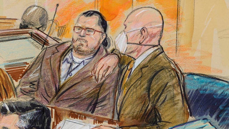 This artist sketch depicts Guy Wesley Reffitt, joined by his lawyer William Welch, right, in Federal Court, in Washington, Monday, Feb. 28, 2022. (Dana Verkouteren via AP)