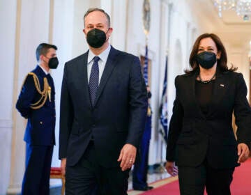 Vice President Kamala Harris and second gentleman Doug Emhoff arrive before President Joe Biden speaks at an event to celebrate Black History Month in the East Room of the White House, Monday, Feb. 28, 2022, in Washington
