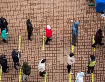 Residents queue to undergo tests for the COVID-19 in China's northeastern Jilin province