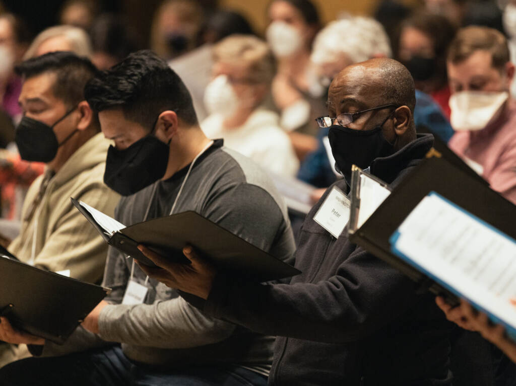 Members of the National Philharmonic Chorale, The Washington Chorus and The Howard University Chorale rehearse Adolphus Hailstork and Herbert Martin's cantata "A Knee on the Neck." 