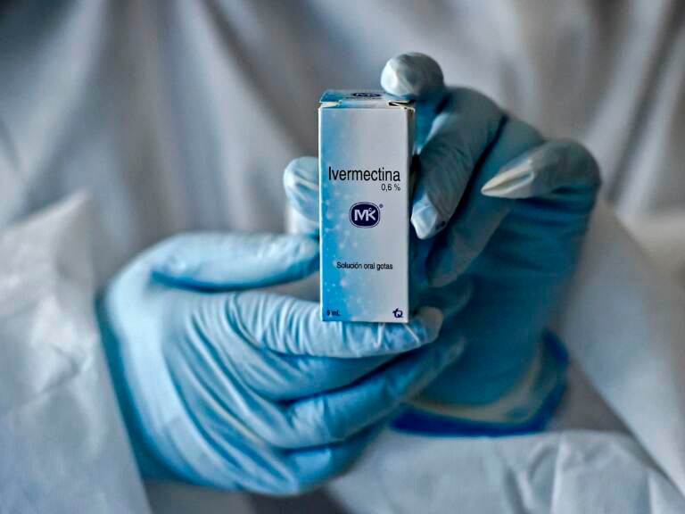 A health worker shows a box containing a bottle of Ivermectin, a medicine authorized by the National Institute for Food and Drug Surveillance (INVIMA) to treat patients with mild, asymptomatic or suspicious COVID-19, as part of a study of the Center for Paediatric Infectious Diseases Studies, in Cali, Colombia, on July 21, 2020. (Luis Robayo/AFP via Getty Images)