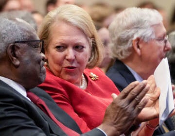 Supreme Court Justice Clarence Thomas sits with his wife and conservative activist Virginia Thomas while he waits to speak at the Heritage Foundation on October 21, 2021 in Washington, DC.