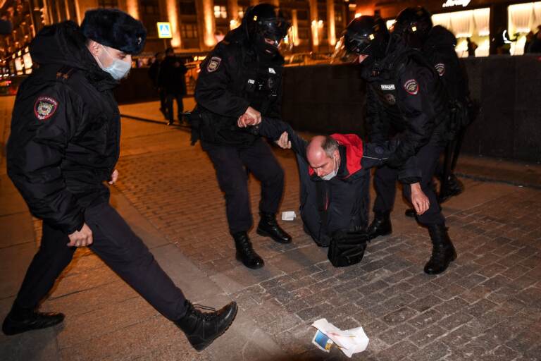 Police officers detain a man during a protest in Moscow Thursday against Russia's invasion of Ukraine. (AFP via Getty Images)