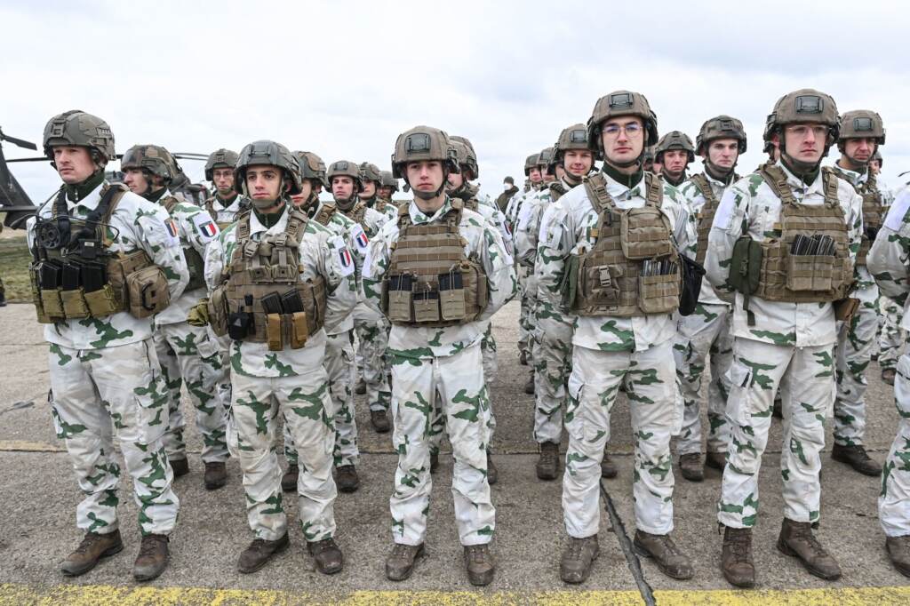 French army personnel stand during an official welcoming ceremony for the French Defense Minister at an air base in Romania on March 6.