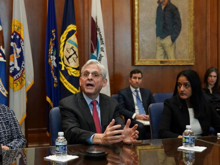 Flanked by US Deputy Attorney General Lisa Monaco (left) and Associate Attorney General Vanita Gupta, Attorney General Merrick Garland convenes a Justice Department component heads meeting in advance of the anniversary of his swearing in, at the Justice Department in  Washington, DC, on March 10, 2022. (Kevin Lamarque//Pool/AFP via Getty Images)