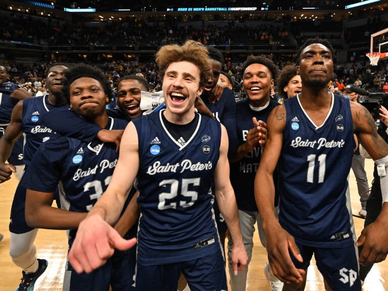 St. Peter's Peacocks players celebrate after defeating Murray State Racers in the second round of the 2022 NCAA Men's Basketball Tournament held at Gainbridge Fieldhouse on March 19, 2022 in Indianapolis, Indiana. Murray State won 70-60. (Photo by Jamie Sabau/NCAA Photos via Getty Images)