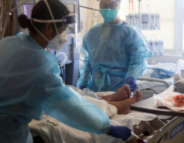 Healthcare workers care for COVID-19 patients in a makeshift ICU at Harbor-UCLA Medical Center on Jan. 21, 2021, in Torrance, Calif. (Mario Tama/Getty Images)