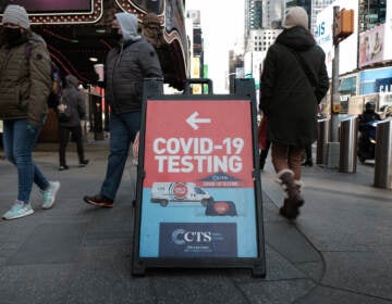 People pass a COVID-19 testing site on a Manhattan street on Jan. 21. The White House says it is running out of money to pay for COVID tests for people who don't have insurance. (Spencer Platt/Getty Images)