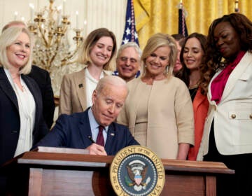 President Joe Biden signs the Ending Forced Arbitration of Sexual Assault and Sexual Harassment Act of 2021 into law on Thursday. (Anna Moneymaker/Getty Images)