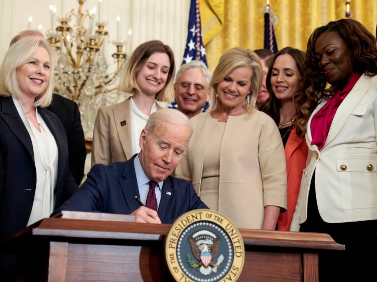 President Joe Biden signs the Ending Forced Arbitration of Sexual Assault and Sexual Harassment Act of 2021 into law on Thursday. (Anna Moneymaker/Getty Images)