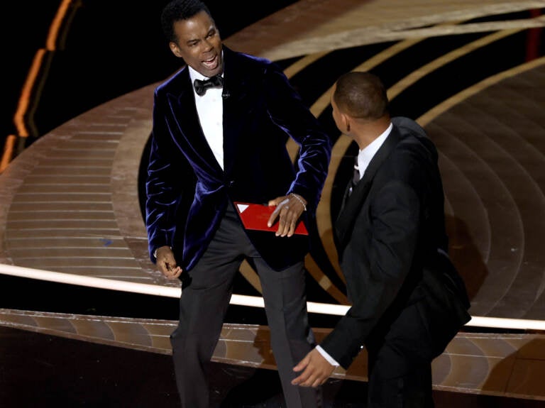 Chris Rock and Will Smith are seen onstage during the 94th Annual Academy Awards at Dolby Theatre following what appeared to be an altercation. (Neilson Barnard/Getty Images)