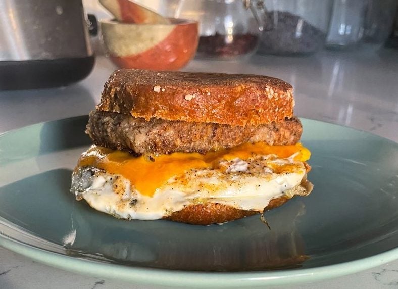 Honeysuckle's breakfast sandwich with BLACKeyed pea scrapple, cheddar, and egg on BLACKenglish muffin.