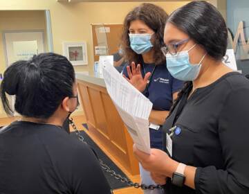 Dr. Megan Werner (center) of Westside Family Healthcare in Wilmington says the root causes of health disparities need to be addressed. (Cris Barrish/WHYY)