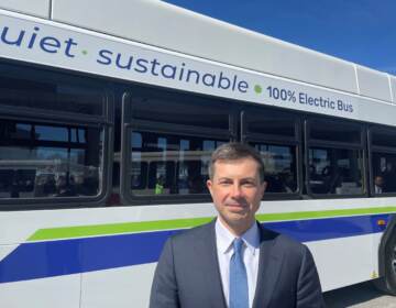 U.S. Transportation Secretary Pete Buttigieg touted electric transit buses during his first visit to former political rival Joe Biden's home state. (Cris Barrish/WHYY)