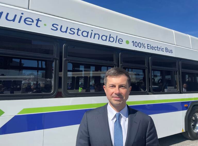 U.S. Transportation Secretary Pete Buttigieg touted electric transit buses during his first visit to former political rival Joe Biden's home state. (Cris Barrish/WHYY)