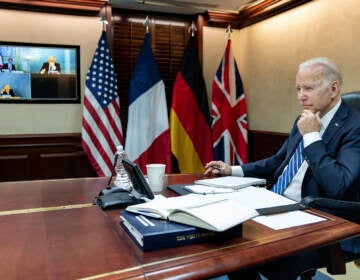 President Joe Biden listens during a secure video call with French President Emmanuel Macron, German Chancellor Olaf Scholz and British Prime Minister Boris Johnson