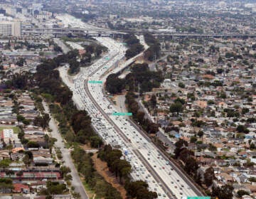 An aerial shot of a highway dividing neighborhoods in Los Angeles.