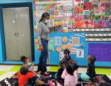 Renada Maddox works with students in her preschool class